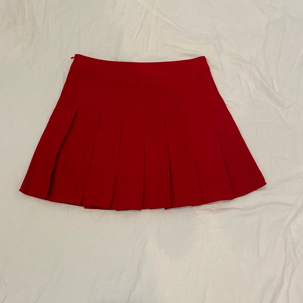 Red pleated skirt